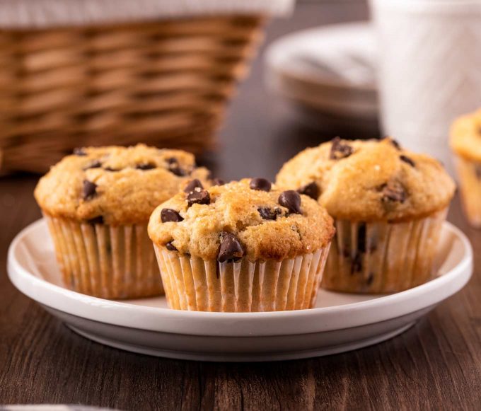 three chocolate chip muffins on a plate