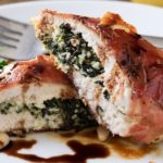 Florentine Stuffed Chicken | This Florentine stuffed chicken is filled with a deliciously cheesy spinach mixture, and toasted pine nuts, then wrapped in prosciutto and baked! | http://thechunkychef.com