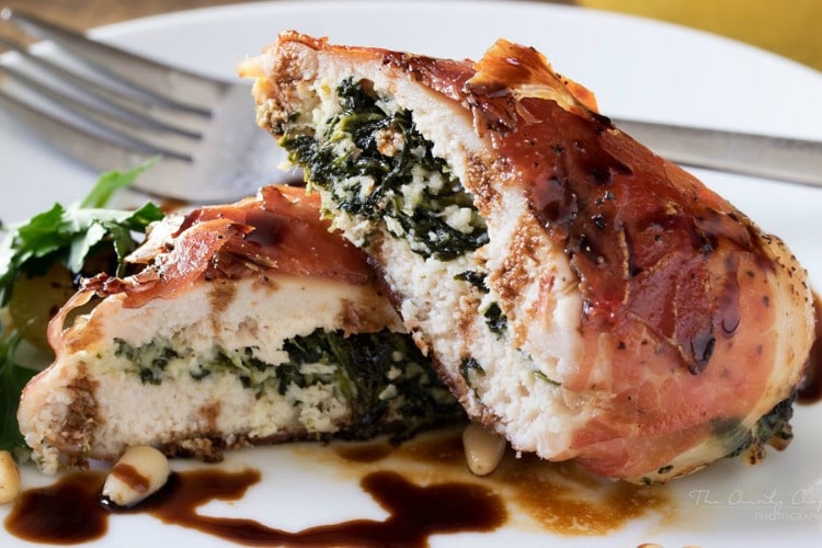 Florentine Stuffed Chicken | This Florentine stuffed chicken is filled with a deliciously cheesy spinach mixture, and toasted pine nuts, then wrapped in prosciutto and baked! | http://thechunkychef.com