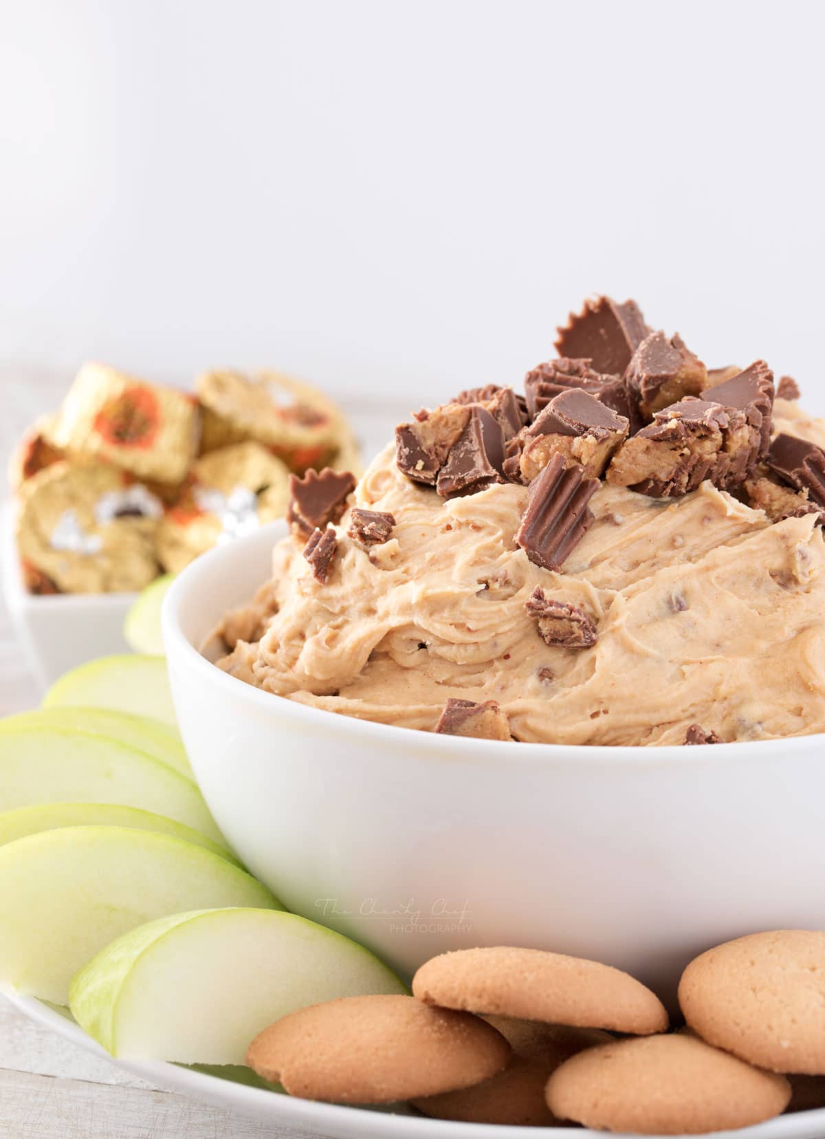 Peanut Butter Cup Cheesecake Dip | Easy to make, this cheesecake dip is loaded with great creamy flavors and pieces of peanut butter cups. Try it with apple slices or vanilla wafers! | http://thechunkychef.com