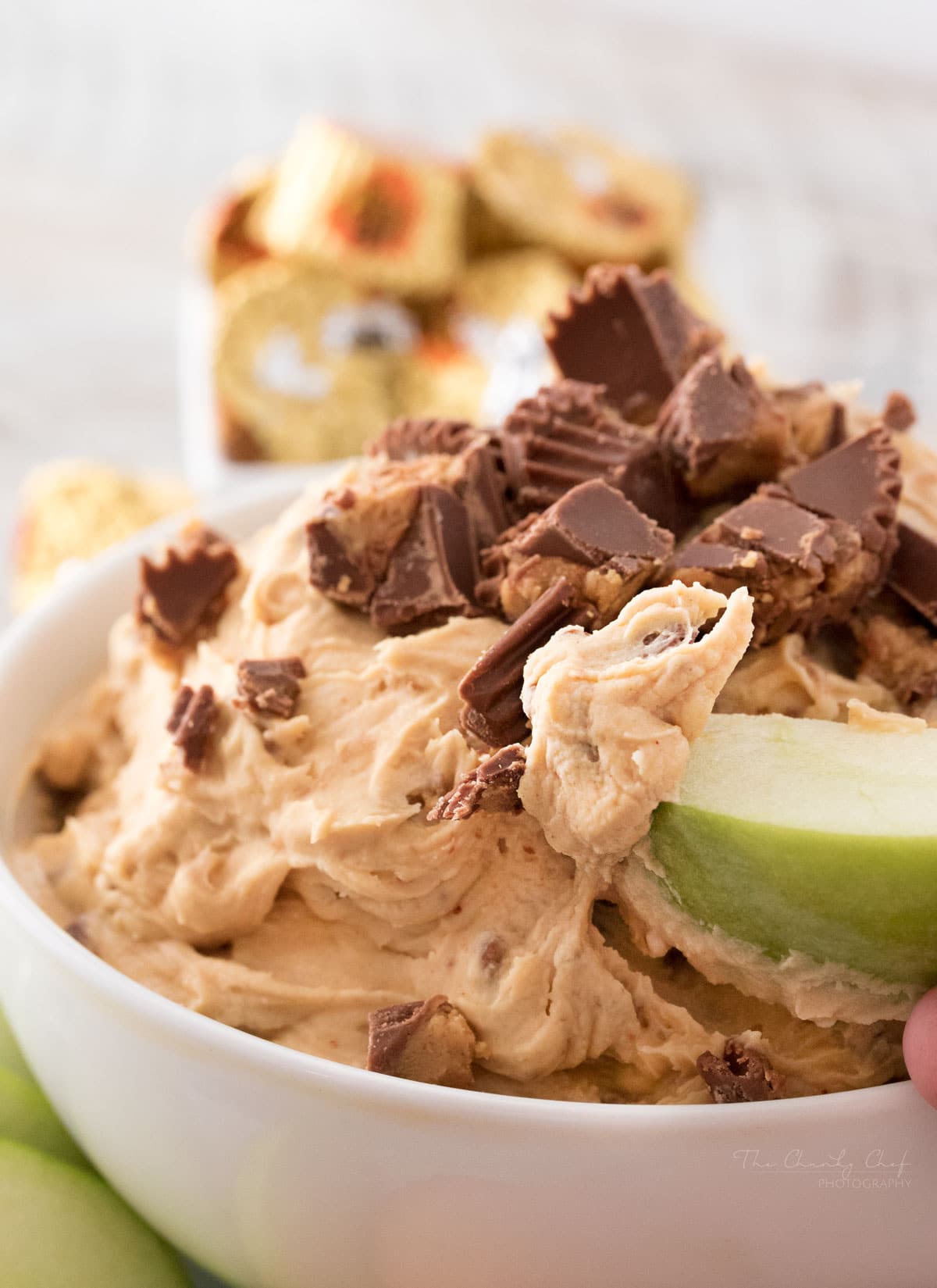 Peanut Butter Cup Cheesecake Dip | Easy to make, this cheesecake dip is loaded with great creamy flavors and pieces of peanut butter cups. Try it with apple slices or vanilla wafers! | http://thechunkychef.com