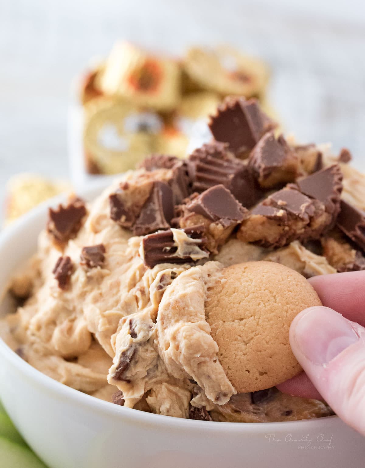 Peanut Butter Cup Cheesecake Dip | Easy to make, this cheesecake dip is loaded with great creamy flavors and pieces of peanut butter cups. Try it with apple slices or vanilla wafers! | http://thechunkychef.com