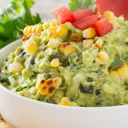 Roasted Poblano Charred Corn Guacamole | Not your average guacamole recipe! Filled with smoky roasted poblano peppers and deliciously charred corn, it's layer after layer of flavor! | http://thechunkychef.com