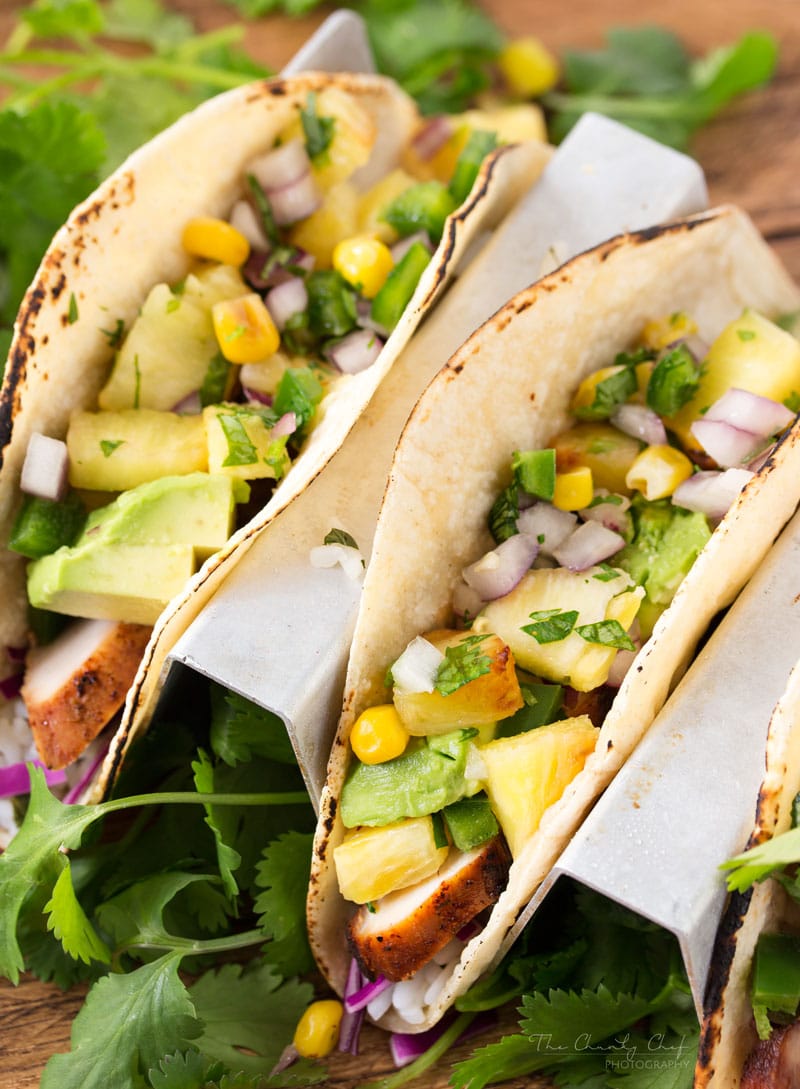 Tequila Lime Chicken Tacos | Tender, juicy, tequila lime chicken is nestled into soft corn tortillas and topped with a smoky sweet grilled pineapple salsa for the most delicious tacos! | http://thechunkychef.com