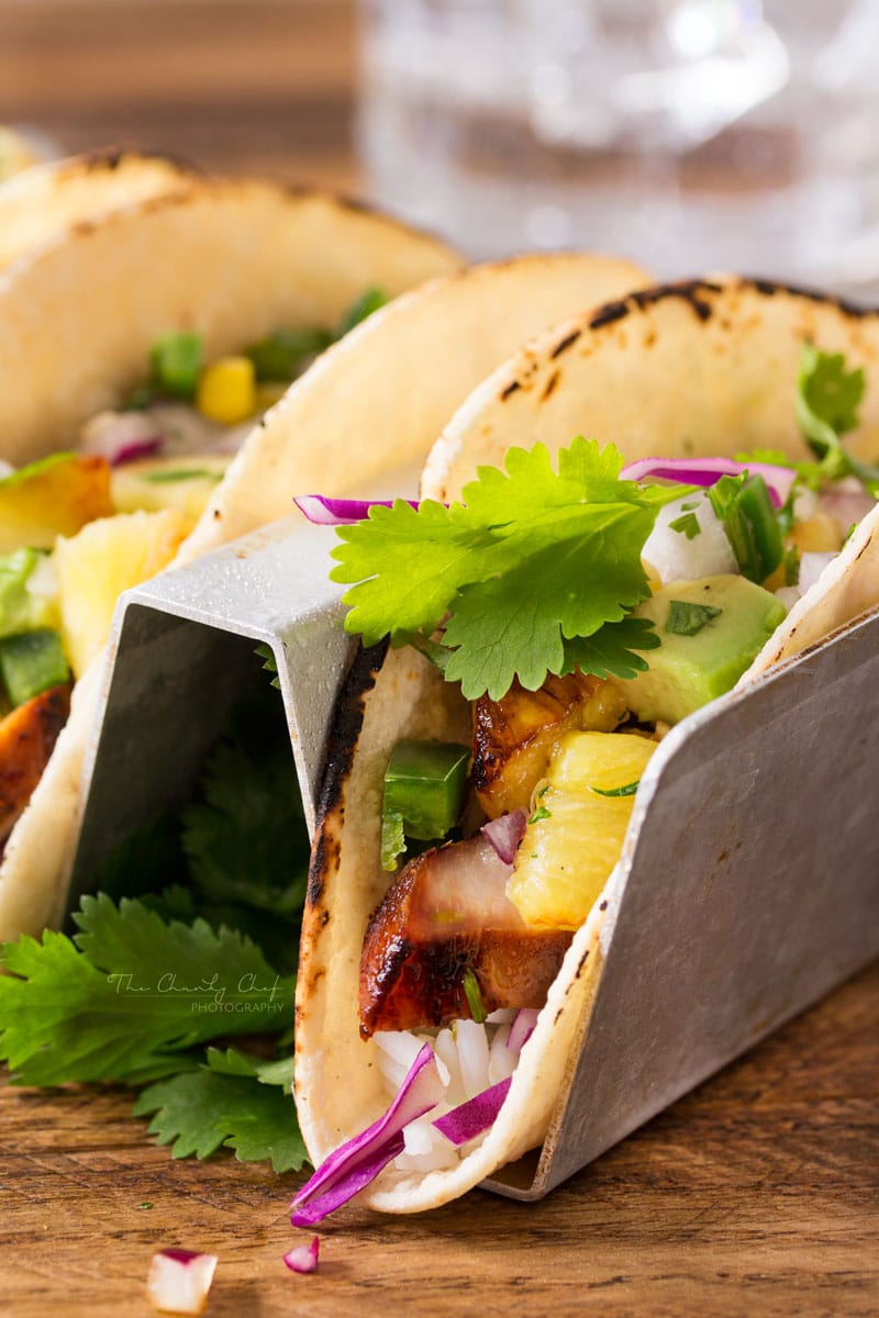 Tequila-Lime-Chicken-Tacos | Tender, juicy, tequila lime chicken is nestled into soft corn tortillas and topped with a smoky sweet grilled pineapple salsa for the most delicious tacos! | http://thechunkychef.com