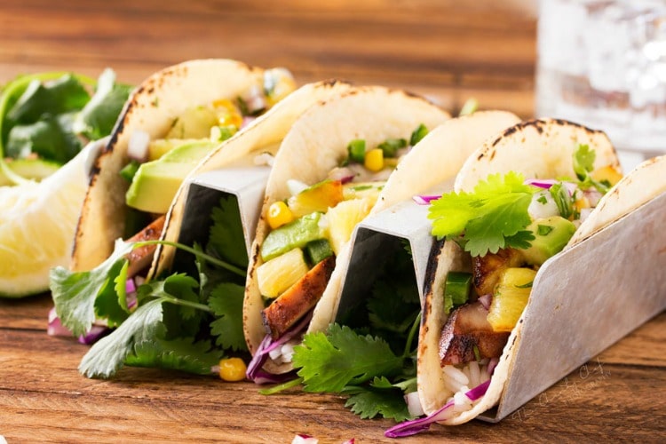 Tequila Lime Chicken Tacos | Tender, juicy, tequila lime chicken is nestled into soft corn tortillas and topped with a smoky sweet grilled pineapple salsa for the most delicious tacos! | http://thechunkychef.com