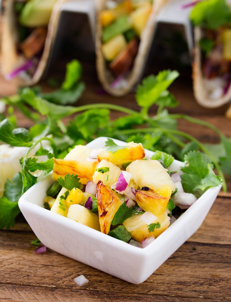 Tequila Lime Chicken Tacos | Tender, juicy, tequila lime chicken is nestled into soft corn tortillas and topped with a smoky sweet grilled pineapple salsa for the most delicious tacos! | http://thechunkychef.com