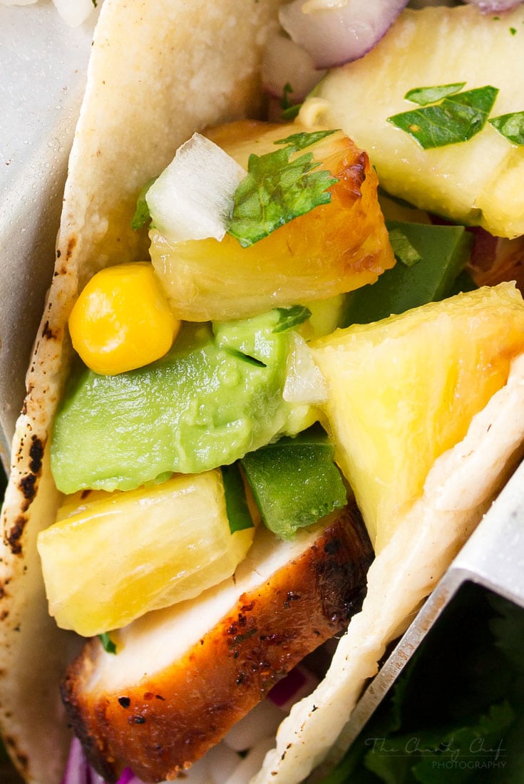 Tequila Lime Chicken Tacos | Tender, juicy, tequila lime chicken is nestled into soft corn tortillas and topped with a smoky sweet grilled pineapple salsa for the most delicious tacos! | http://thechunkychef.com