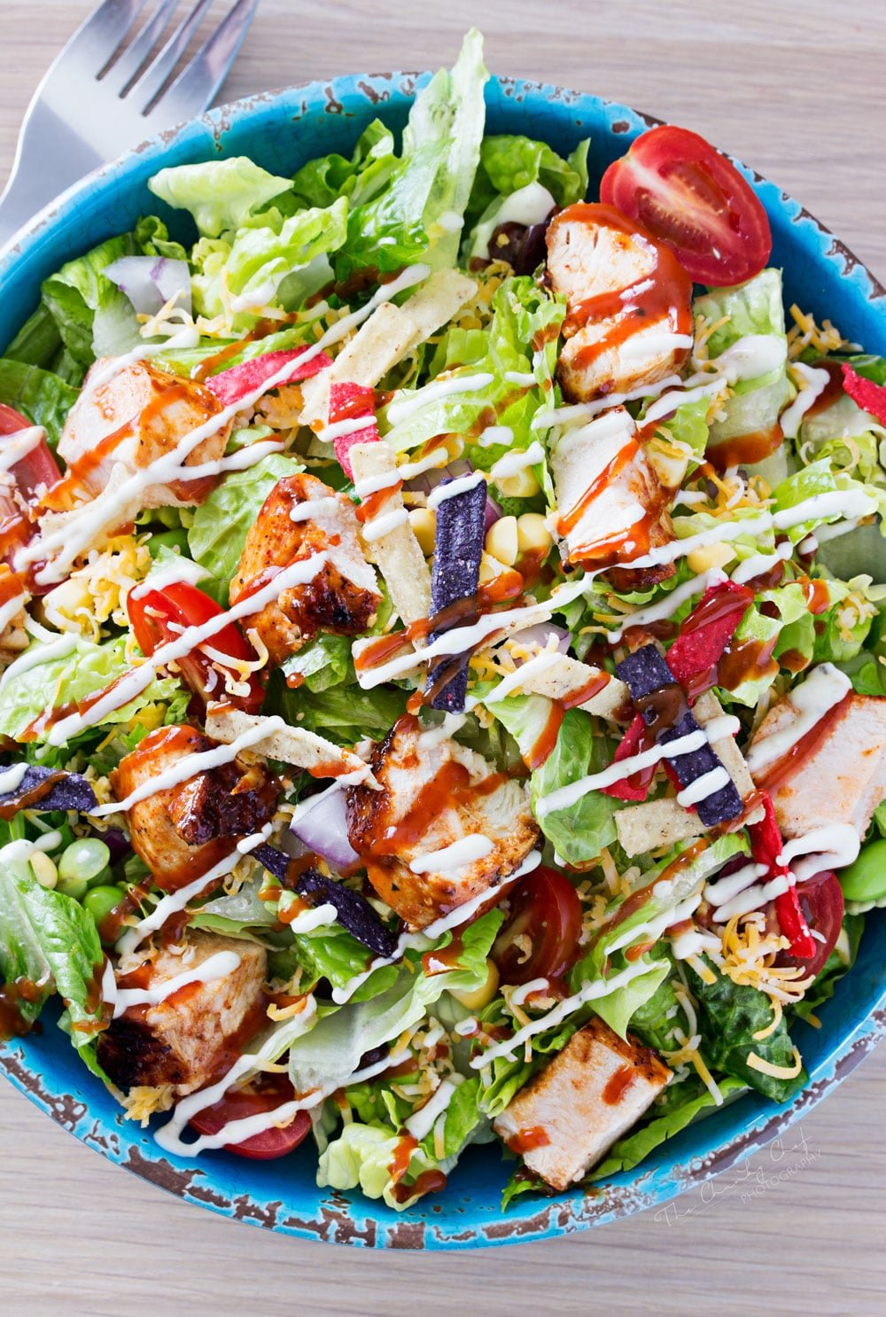 BBQ Chicken Salad | This fresh and crisp bbq chicken salad is packed with veggies, tender grilled chicken, and topped with bbq sauce and a green chile ranch dressing! | http://thechunkychef.com