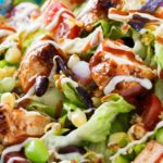 BBQ Chicken Salad | This fresh and crisp bbq chicken salad is packed with veggies, tender grilled chicken, and topped with bbq sauce and a green chile ranch dressing! | http://thechunkychef.com