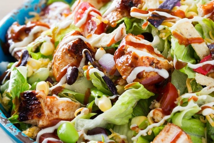 BBQ Chicken Salad | This fresh and crisp bbq chicken salad is packed with veggies, tender grilled chicken, and topped with bbq sauce and a green chile ranch dressing! | http://thechunkychef.com