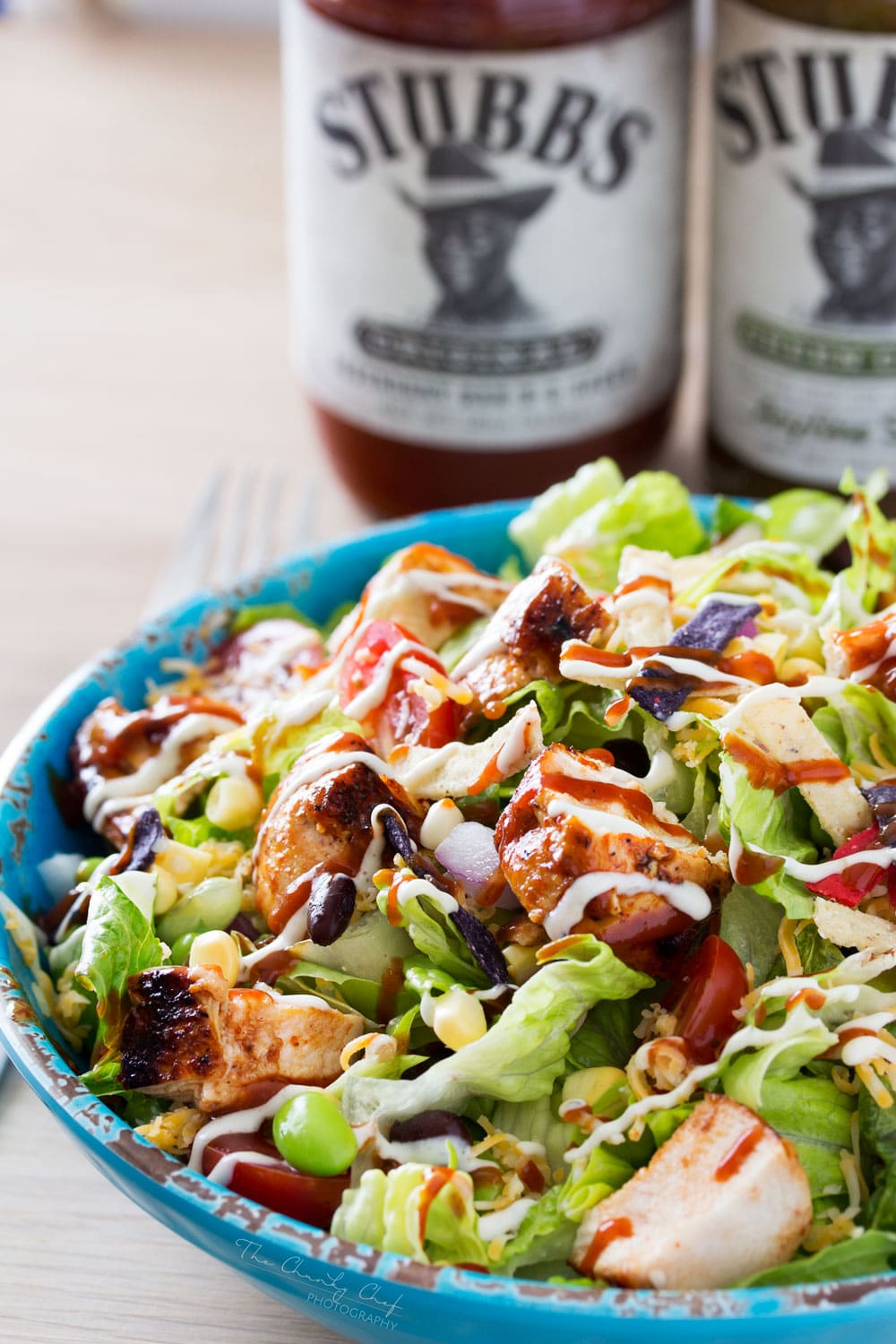 BBQ Chicken Salad | This fresh and crisp bbq chicken salad is packed with veggies, tender grilled chicken, and topped with bbq sauce and a green chile ranch dressing! | http://thechunkychef.com