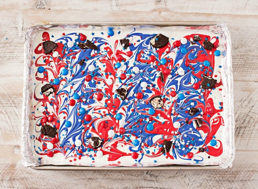 Festive Red White and Blue Bark | This simple and fun no-bake bark recipe is perfect for Memorial Day or Independence Day! So simple, even your kids can make it! | http://thechunkychef.com