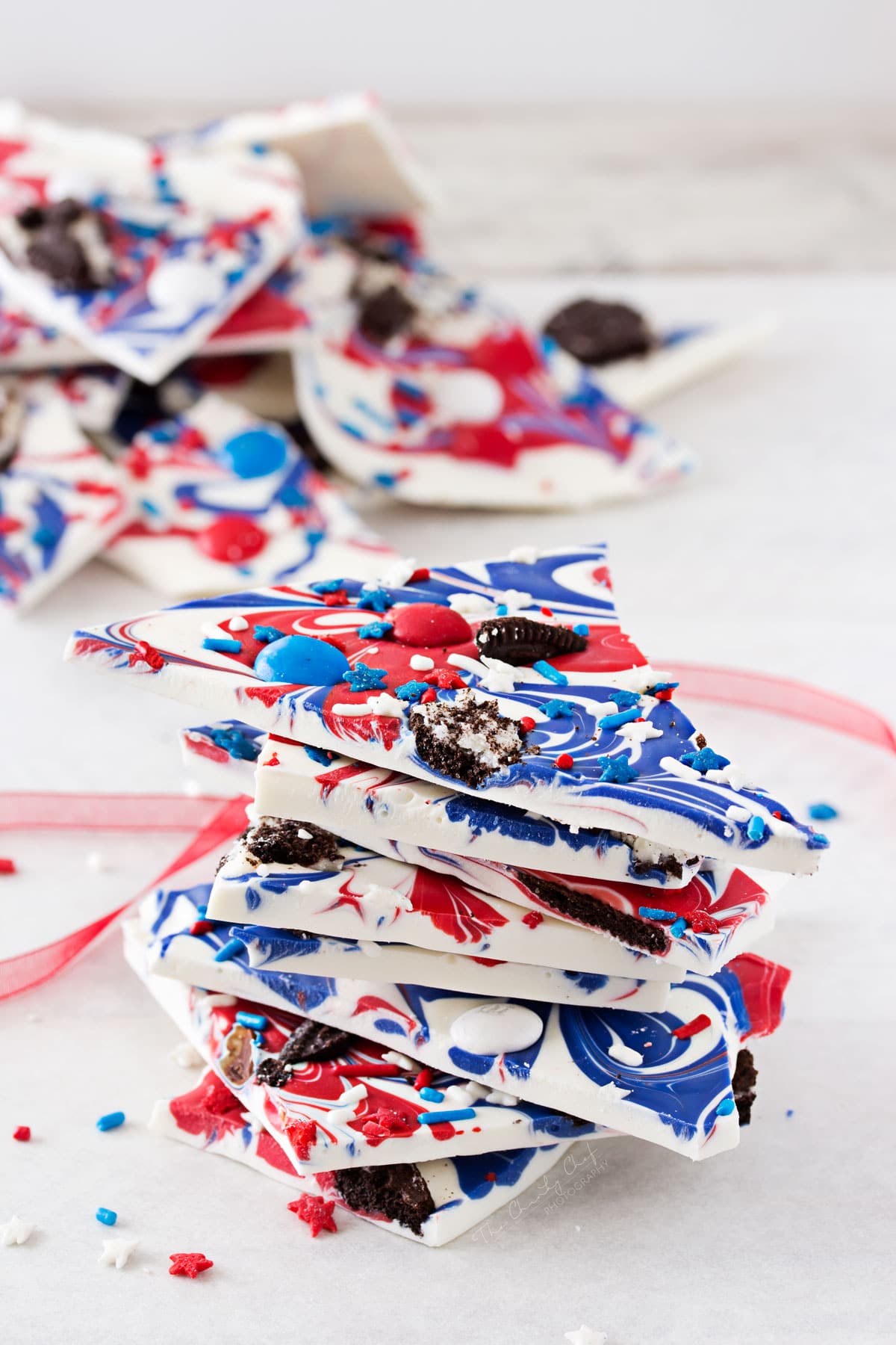 Festive Red White and Blue Bark | This simple and fun no-bake bark recipe is perfect for Memorial Day or Independence Day! So simple, even your kids can make it! | http://thechunkychef.com