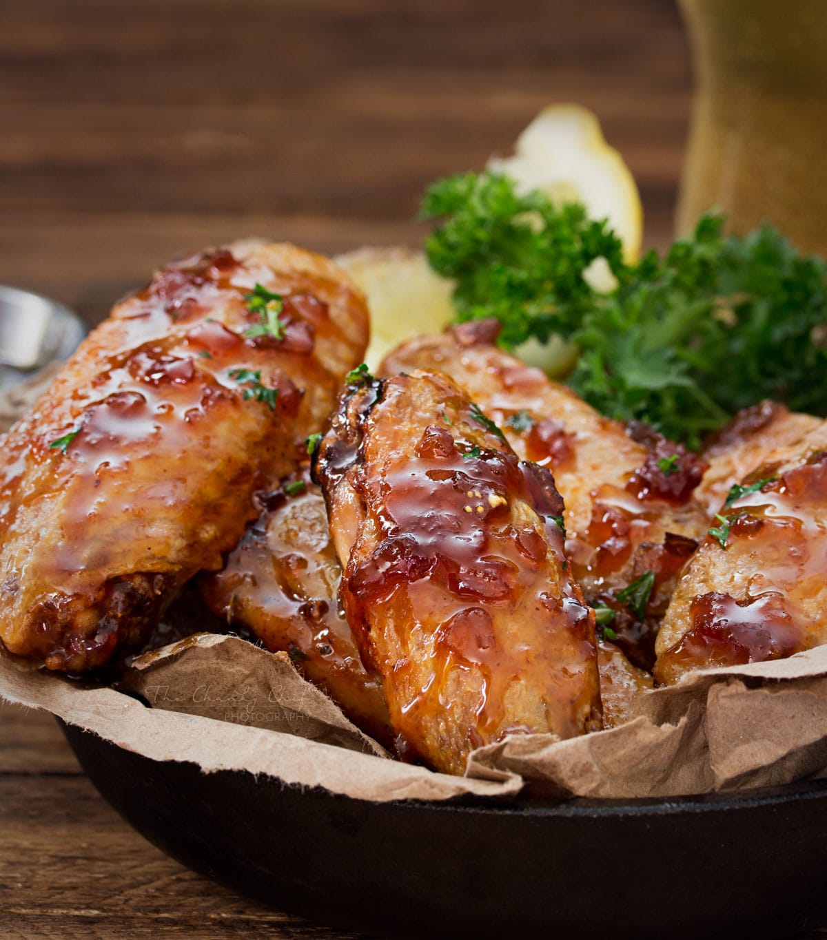 Jack Daniels Glazed Baked Chicken Wings | No need to fry... these baked chicken wings are SUPER crispy! Coated in a flavor-packed copycat Jack Daniels sauce, they're the perfect appetizer! | http://thechunkychef.com