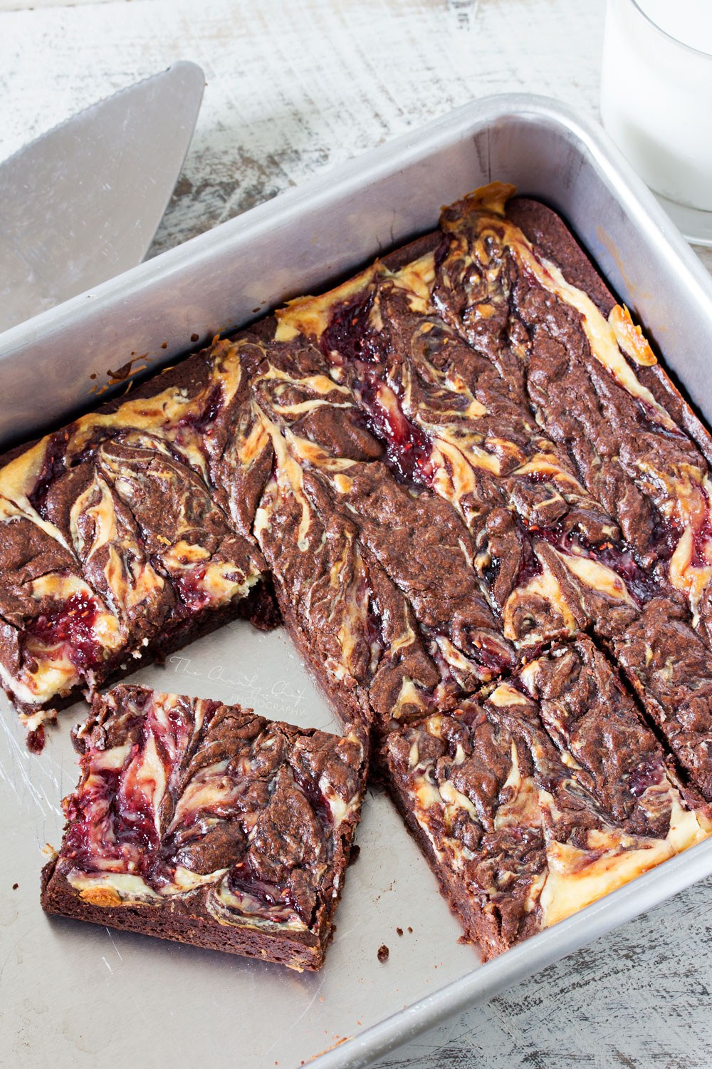 Raspberry Cheesecake Brownies | Rich, fudgy brownies are topped with a creamy cheesecake layer that's been swirled with sweet raspberry jam. The best cheesecake brownies! |http://thechunkychef.com