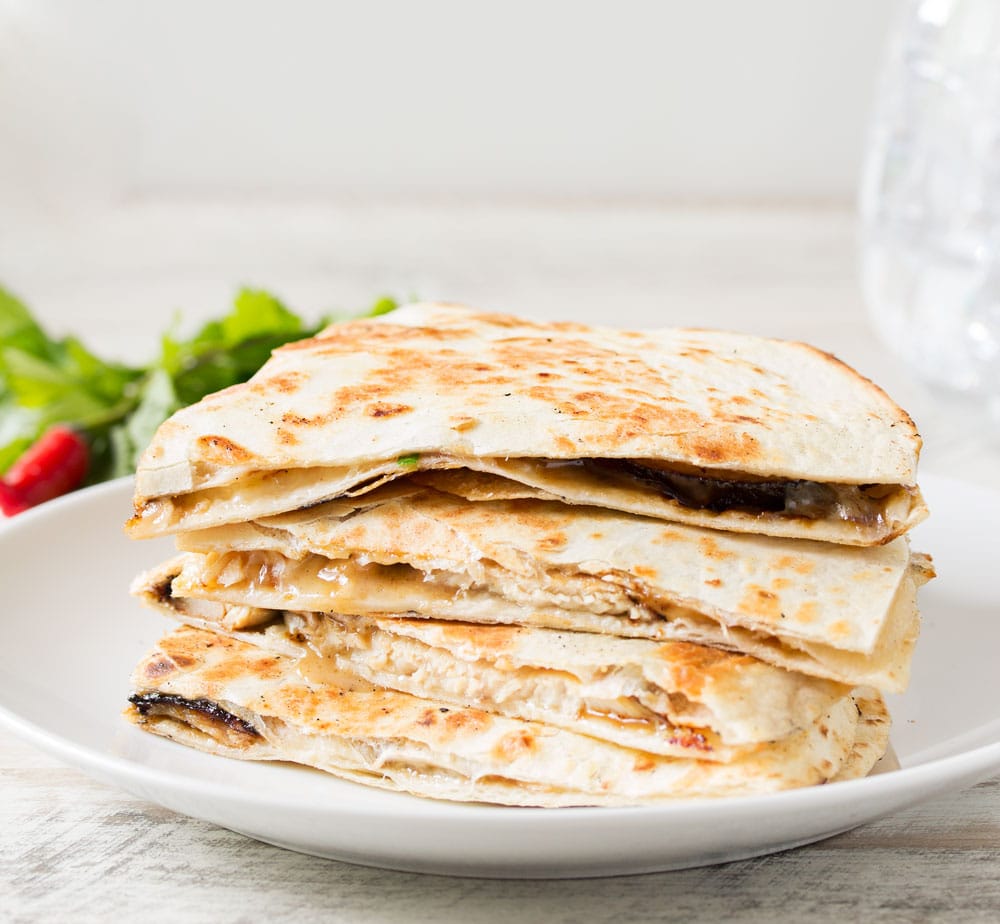 Thai Peanut Chicken Quesadillas | Thai chicken gets a fusion twist in these Thai peanut chicken quesadillas! Loaded with flavor and fun to make, try them tonight! | http://thechunkychef.com