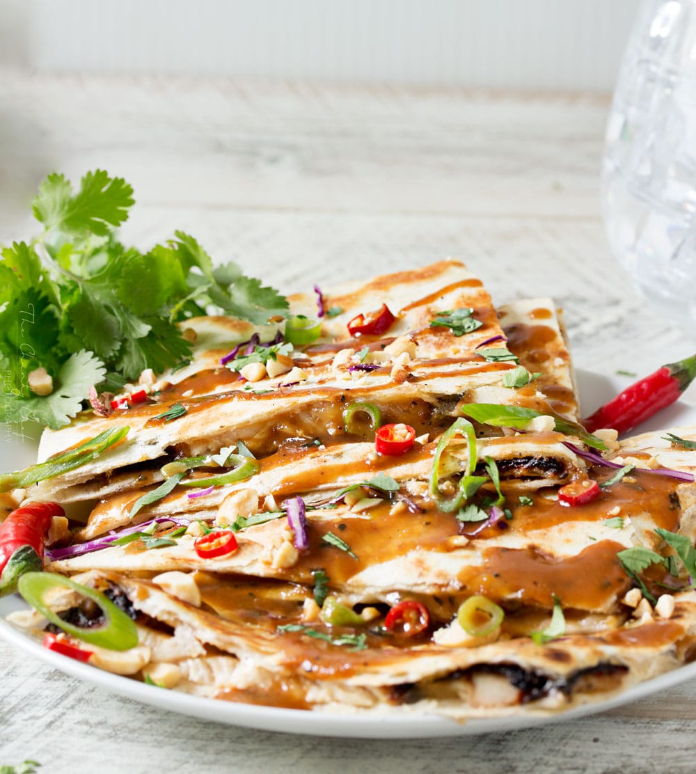 Thai Peanut Chicken Quesadillas | Thai chicken gets a fusion twist in these Thai peanut chicken quesadillas! Loaded with flavor and fun to make, try them tonight! | http://thechunkychef.com