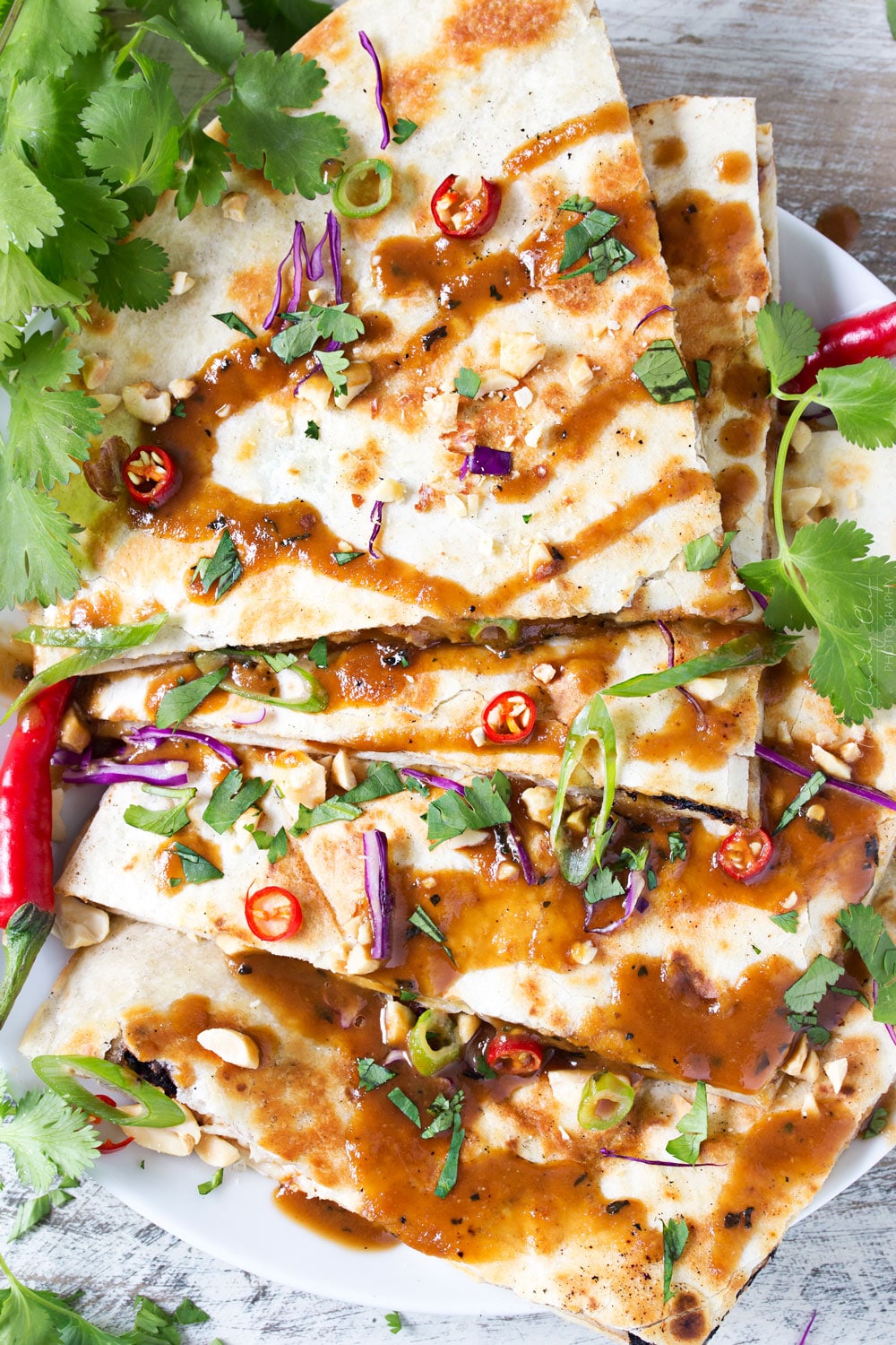 Thai Peanut Chicken Quesadillas | Thai chicken gets a fusion twist in these Thai peanut chicken quesadillas! Loaded with flavor and fun to make, try them tonight! | http://thechunkychef.com