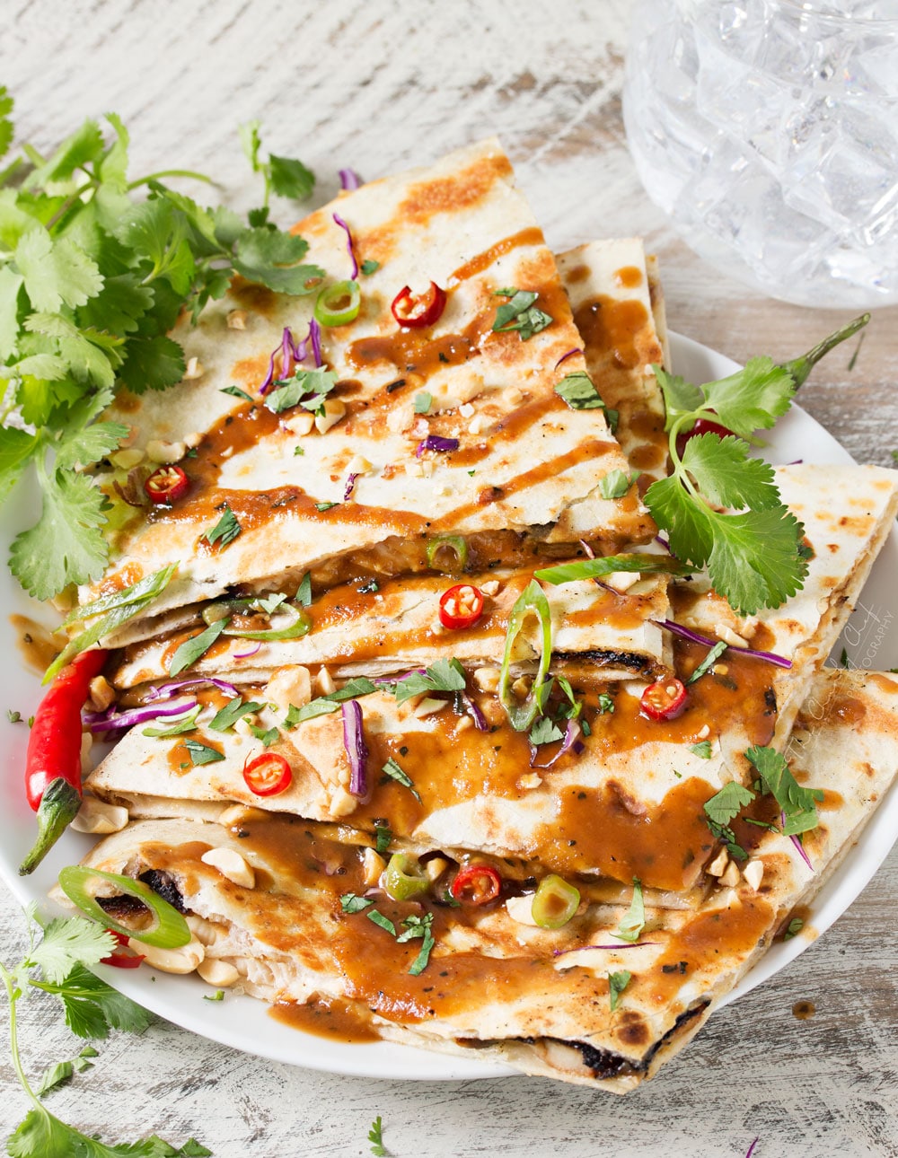 Thai Peanut Chicken Quesadillas | Thai chicken gets a fusion twist in these Thai peanut chicken quesadillas! Loaded with flavor and fun to make, try them tonight! | http://thechunkychef.com