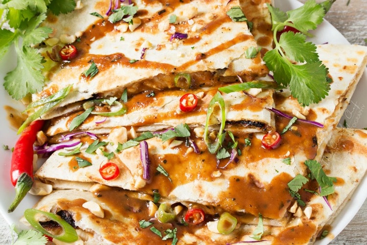 Thai Peanut Chicken Quesadillas | Thai chicken gets a fusion twist in these Thai peanut chicken quesadillas! Loaded with flavor and fun to make, try them tonight! | http://thechunkychef.com