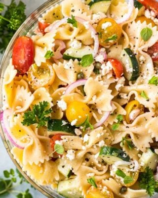 Always a crowd-pleaser, this pasta salad has won first place in several potluck contests. Summer vegetables, tender pasta, salty cheese, and a mouthwatering zesty dressing! #pastasalad #potluck #bbq #italian #greek #mediterranean #pasta, #salad #makeaheadrecipe #easyrecipe
