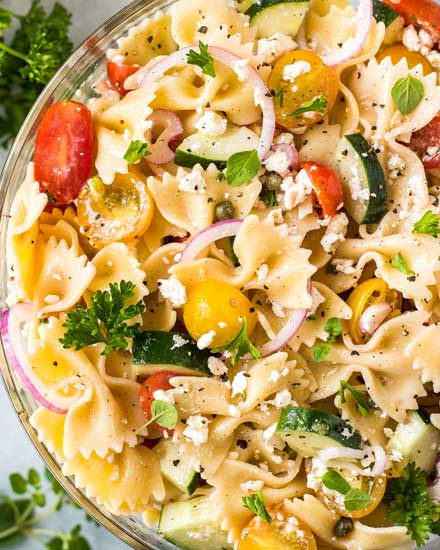 Always a crowd-pleaser, this pasta salad has won first place in several potluck contests.  Summer vegetables, tender pasta, salty cheese, and a mouthwatering zesty dressing! #pastasalad #potluck #bbq #italian #greek #mediterranean #pasta, #salad #makeaheadrecipe #easyrecipe