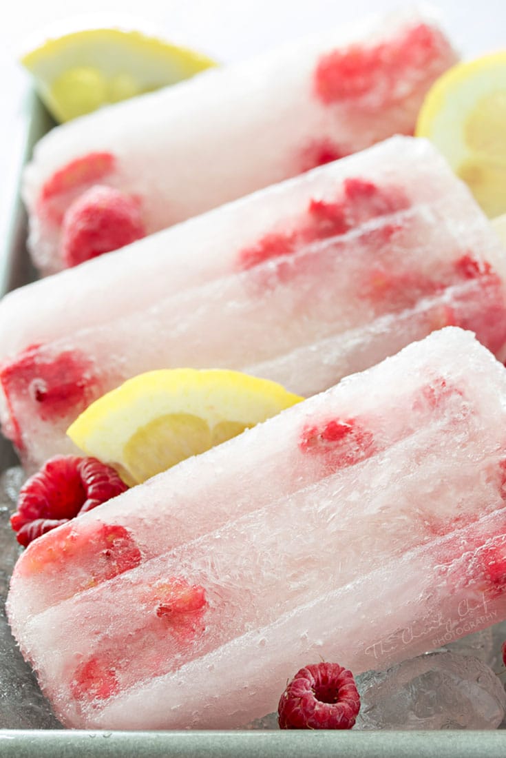 Raspberry Lemonade Popsicles | These raspberry lemonade popsicles are so easy to make! They're a refreshing way to cool down on a hot day, and loved by kids and adults!