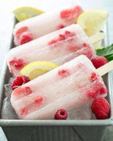 Raspberry Lemonade Popsicles | These raspberry lemonade popsicles are so easy to make! They're a refreshing way to cool down on a hot day, and loved by kids and adults!