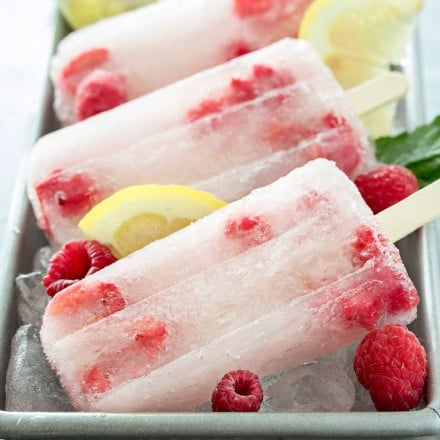 Raspberry Lemonade Popsicles | These raspberry lemonade popsicles are so easy to make! They're a refreshing way to cool down on a hot day, and loved by kids and adults!