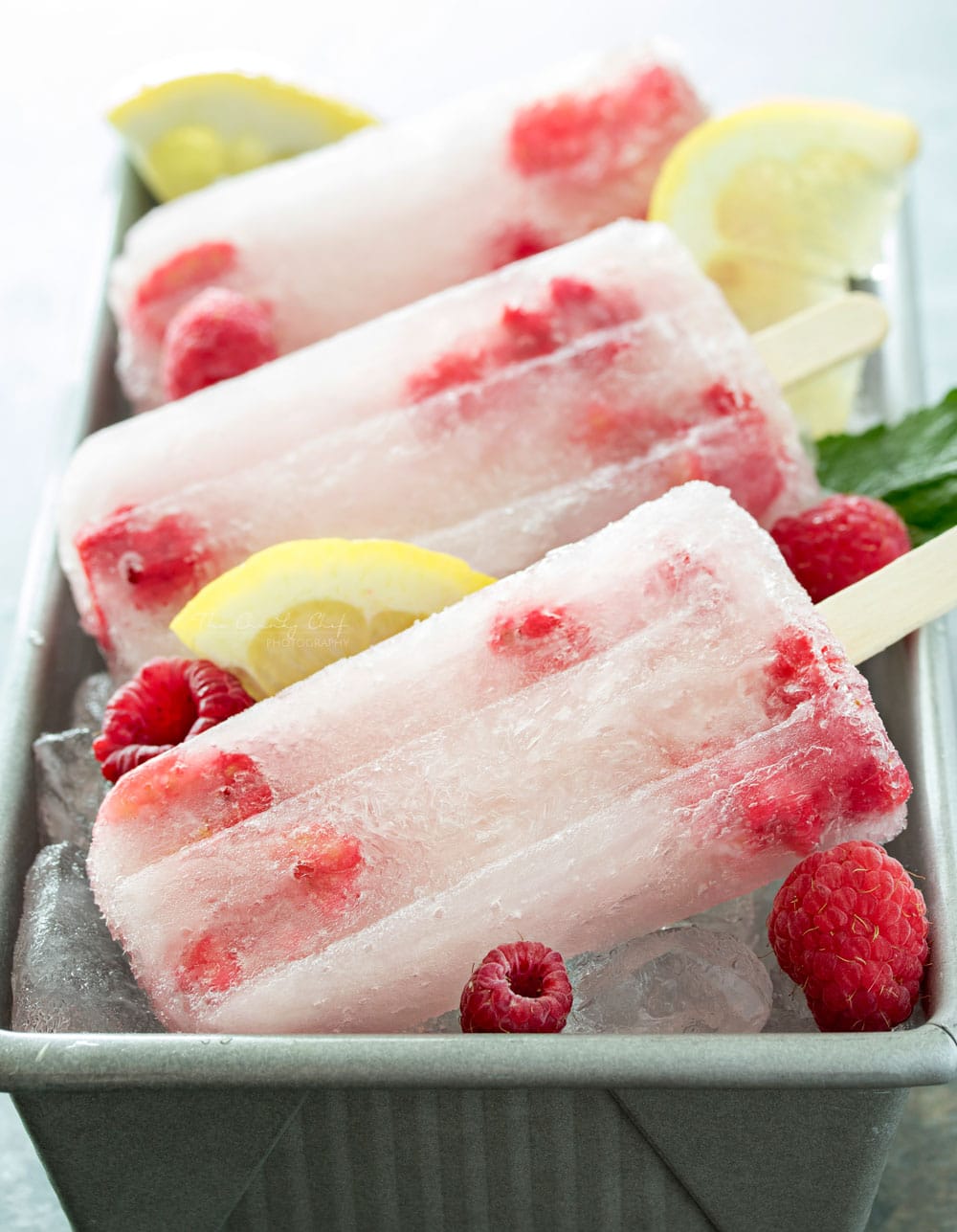 Raspberry Lemonade Popsicles | These raspberry lemonade popsicles are so easy to make! They're a refreshing way to cool down on a hot day, and loved by kids and adults!