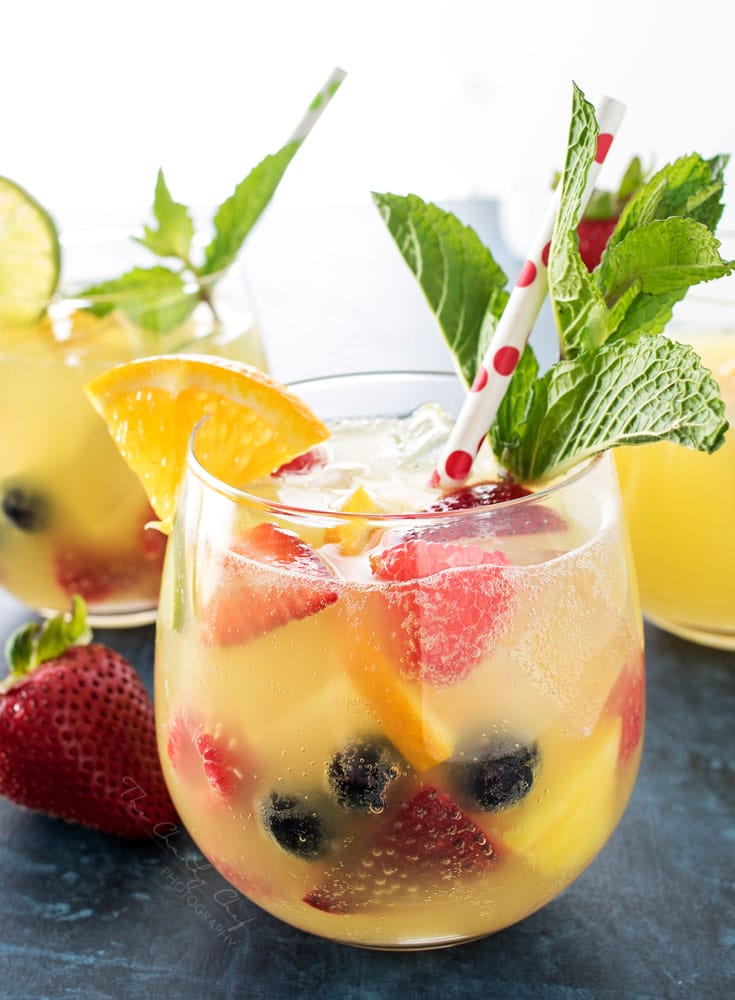 Summer Pineapple Punch | This sweet and easy to make pineapple punch will be the hit of any party! Just 4 simple ingredients plus fresh fruit and pretty garnishes! | http://thechunkychef.com