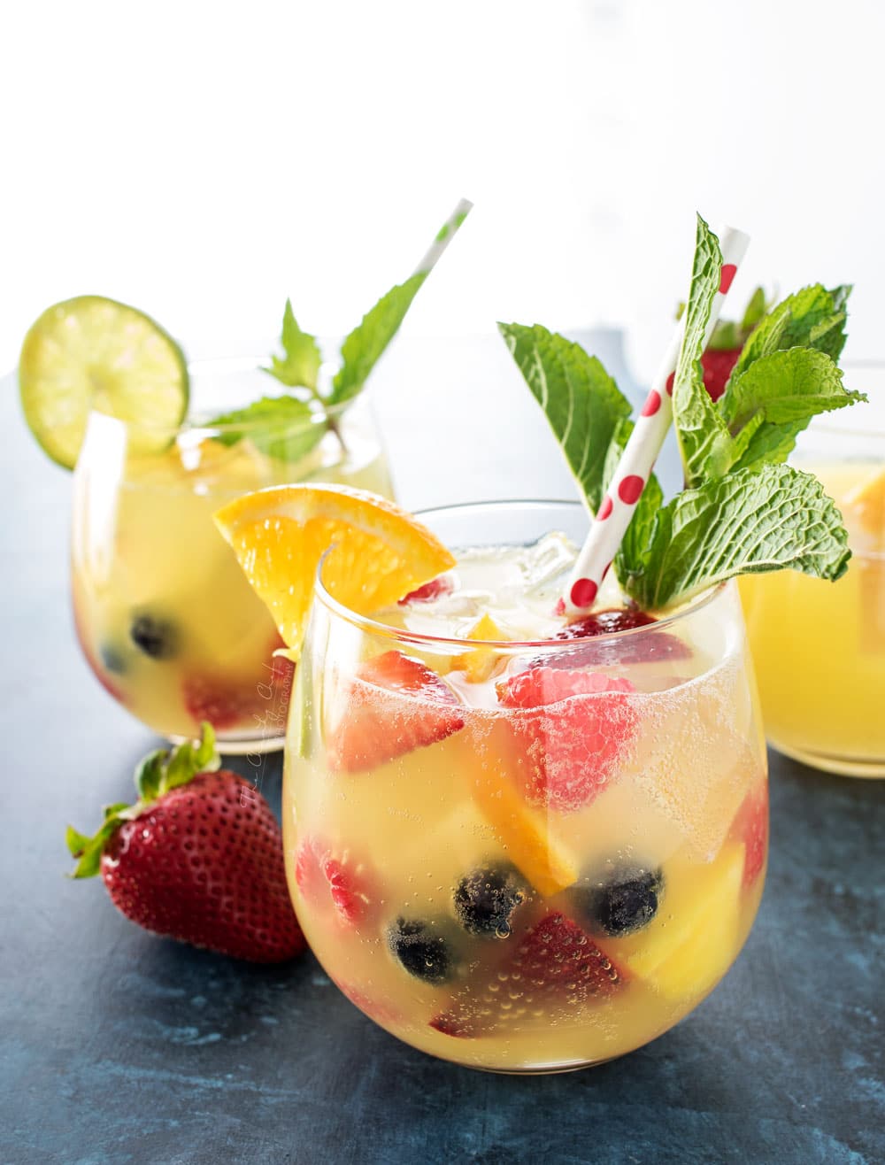 Summer Pineapple Punch | This sweet and easy to make pineapple punch will be the hit of any party! Just 4 simple ingredients plus fresh fruit and pretty garnishes! | http://thechunkychef.com
