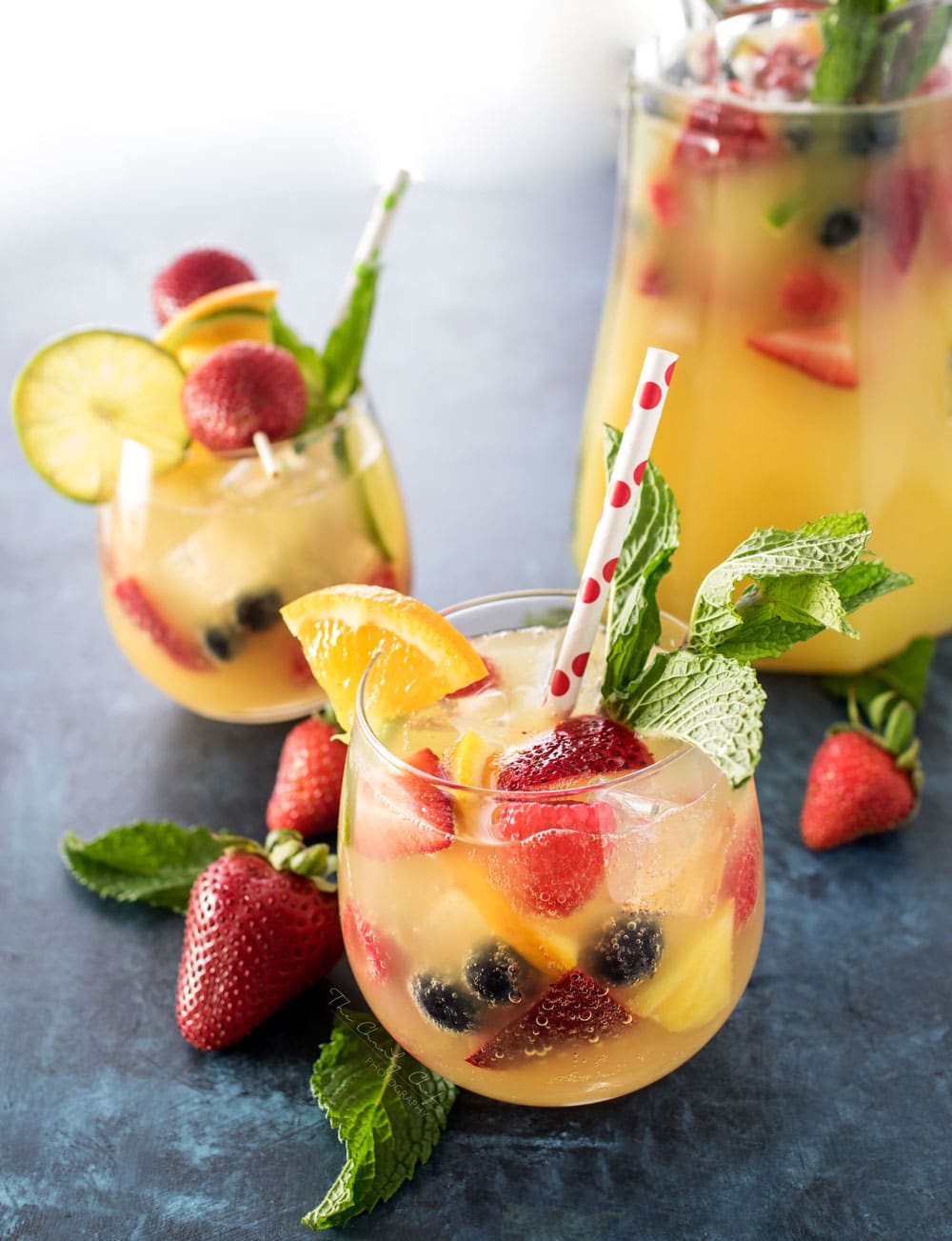 Summer Pineapple Punch | This sweet and easy to make pineapple punch will be the hit of any party! Just 4 simple ingredients plus fresh fruit and pretty garnishes! | http://thechunkychef.com