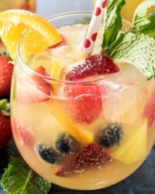 Summer Pineapple Punch | This sweet and easy to make pineapple punch will be the hit of any party! Just 4 simple ingredients plus fresh fruit and pretty garnishes! | http://thechunkychef.com