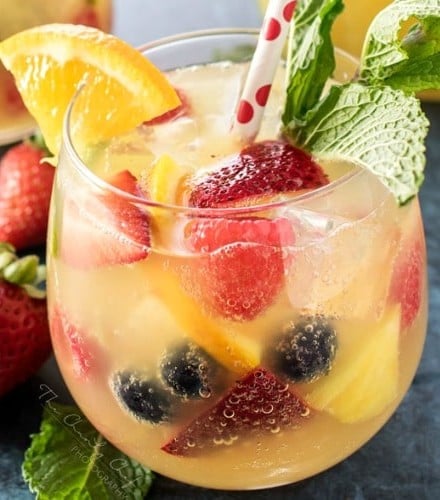 Summer Pineapple Punch | This sweet and easy to make pineapple punch will be the hit of any party! Just 4 simple ingredients plus fresh fruit and pretty garnishes! | http://thechunkychef.com