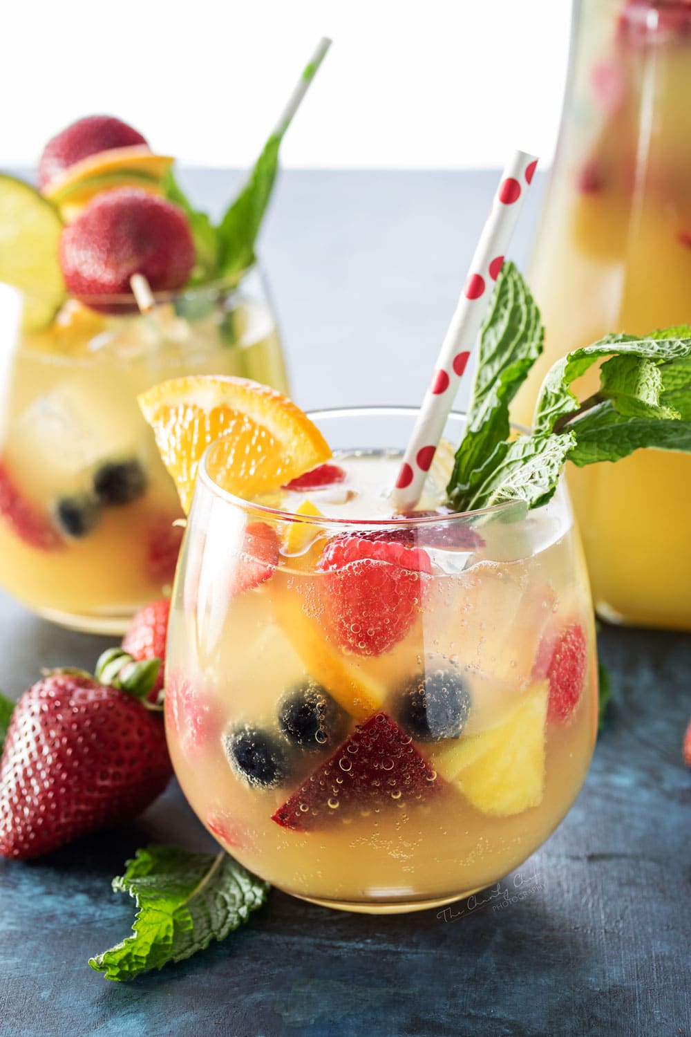 Summer Pineapple Punch | This sweet and easy to make pineapple punch will be the hit of any party! Just 4 simple ingredients plus fresh fruit and pretty garnishes! | http://thechunkychef.com