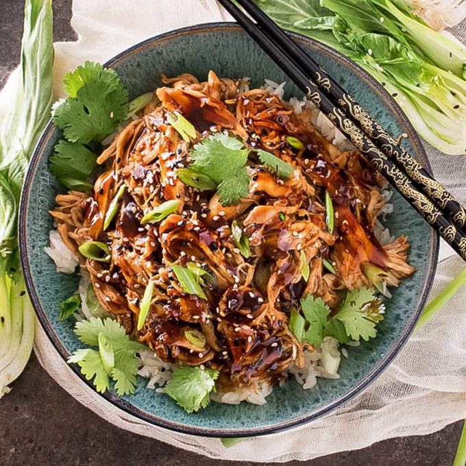 This Honey Garlic Chicken is one incredible weeknight dinner idea. Juicy chicken coated and cooked with a glorious sauce made with soy, hoisin, garlic, honey and more! Toss it all in the slow cooker and let it do the work for you! #dinner #chicken #asian #honey #garlic #honeygarlic #easyrecipe #weeknight #slowcooker #crockpot
