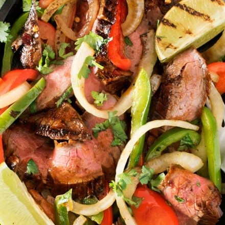 Carne Asada Steak Fajitas | Tender marinated carne asada steak, grilled until charred on the outside, and tossed with grilled peppers and onions for the most delicious steak fajitas! | http://thechunkychef.com