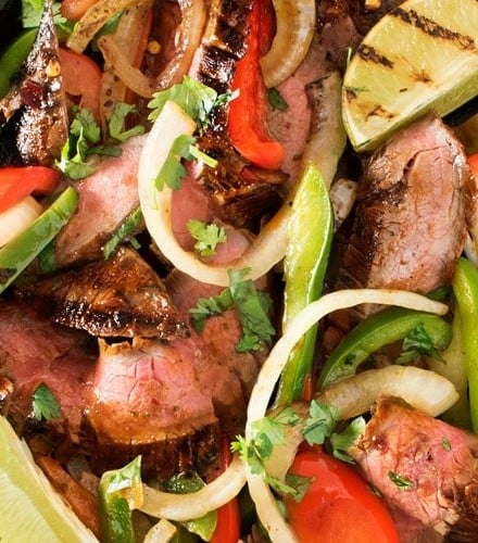 Carne Asada Steak Fajitas | Tender marinated carne asada steak, grilled until charred on the outside, and tossed with grilled peppers and onions for the most delicious steak fajitas! | http://thechunkychef.com