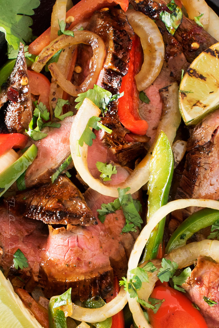 Carne Asada Steak Fajitas | Tender marinated carne asada steak, grilled until charred on the outside, and tossed with grilled peppers and onions for the most delicious steak fajitas! | http://thechunkychef.com