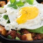 Chorizo Potato Hash with Jalapeno Aioli | Kick your breakfast up a notch with this delicious chorizo potato hash, topped with a sunny side up egg and drizzled with a homemade jalapeno aioli! |http://thechunkychef.com