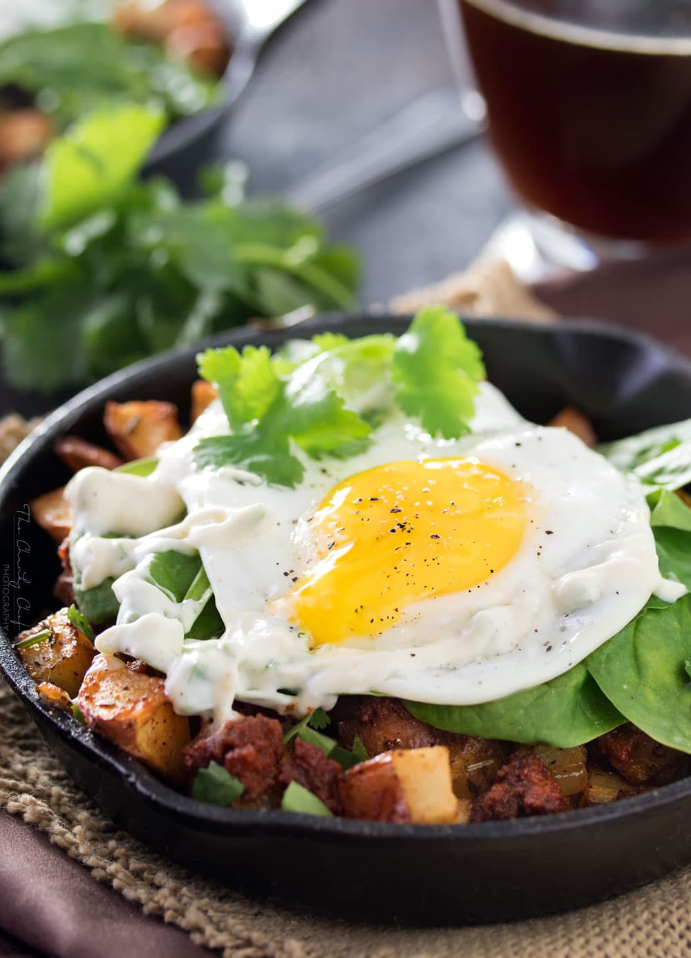 Chorizo Potato Hash with Jalapeno Aioli | Kick your breakfast up a notch with this delicious chorizo potato hash, topped with a sunny side up egg and drizzled with a homemade jalapeno aioli! |http://thechunkychef.com