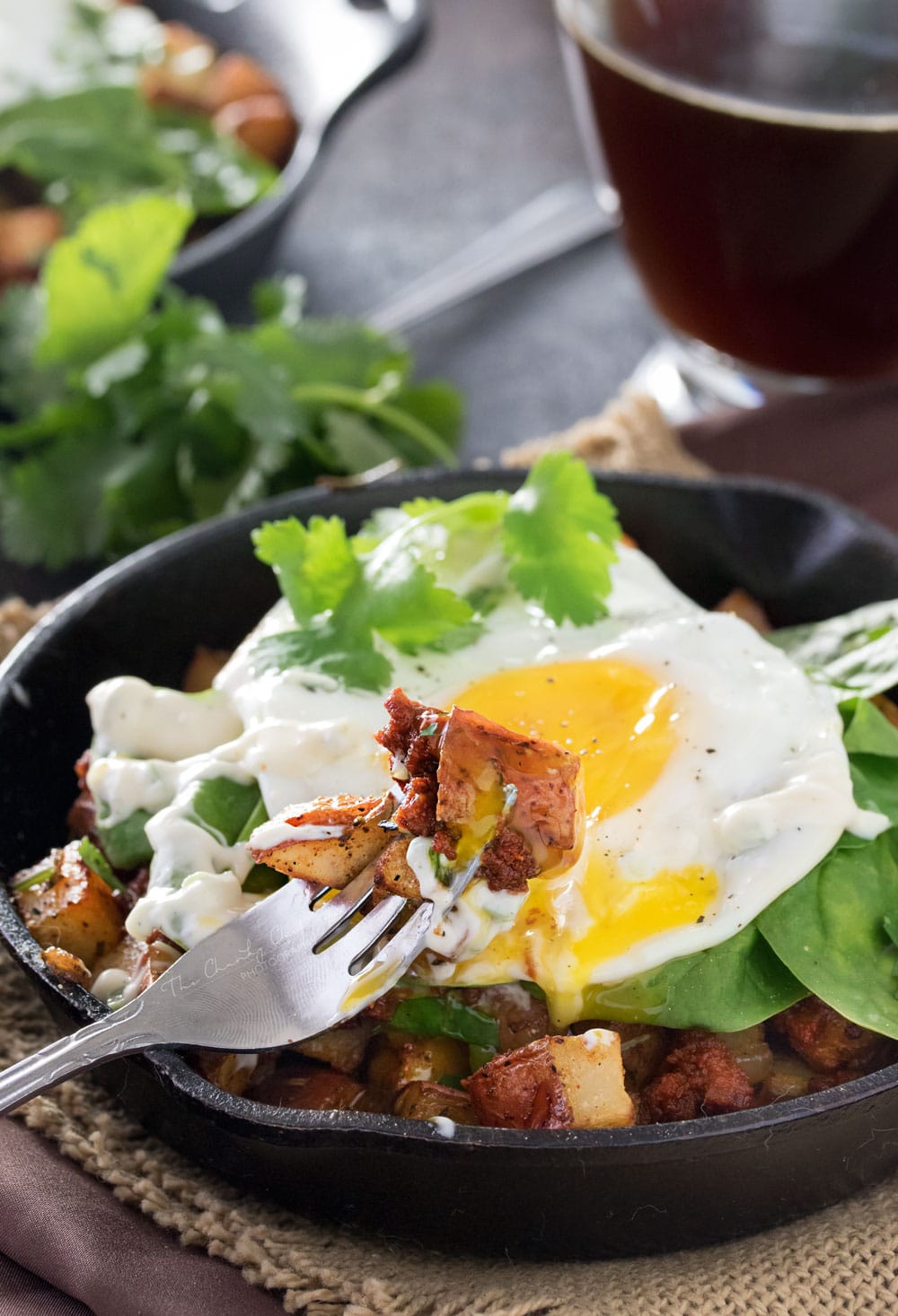 Chorizo Potato Hash with Jalapeno Aioli | Kick your breakfast up a notch with this delicious chorizo potato hash, topped with a sunny side up egg and drizzled with a homemade jalapeno aioli! |http://thechunkychef.com