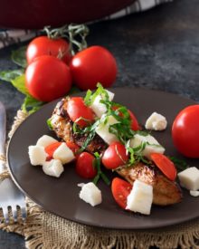 Garlic Balsamic Caprese Chicken | Juicy caprese chicken, marinated in a garlic balsamic marinade, is baked to perfection with burst cherry tomatoes, melted mozzarella cheese, fresh basil! | http://thechunkychef.com