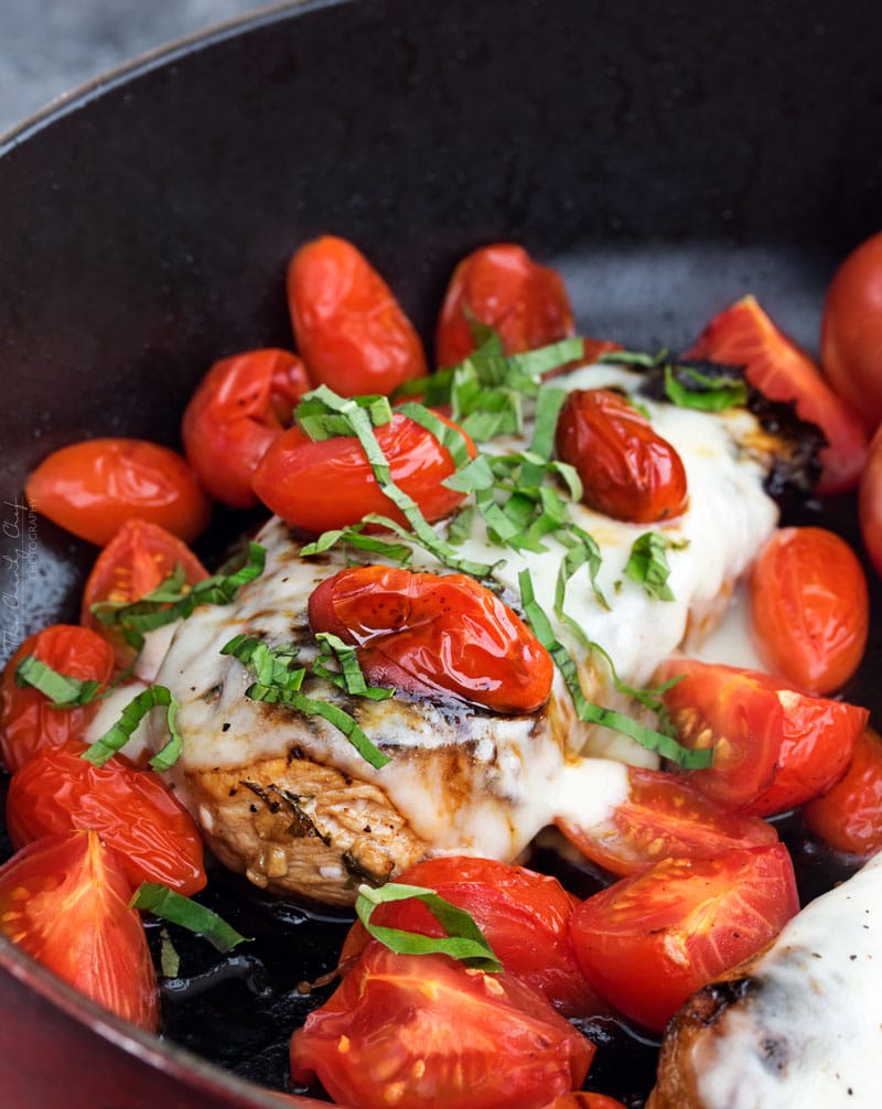 Garlic Balsamic Caprese Chicken | Juicy caprese chicken, marinated in a garlic balsamic marinade, is baked to perfection with burst cherry tomatoes, melted mozzarella cheese, fresh basil! | http://thechunkychef.com