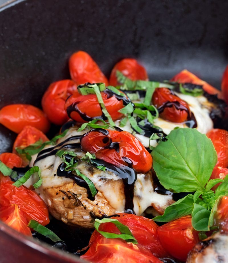 Garlic Balsamic Caprese Chicken | Juicy caprese chicken, marinated in a garlic balsamic marinade, is baked to perfection with burst cherry tomatoes, melted mozzarella cheese, fresh basil! | http://thechunkychef.com