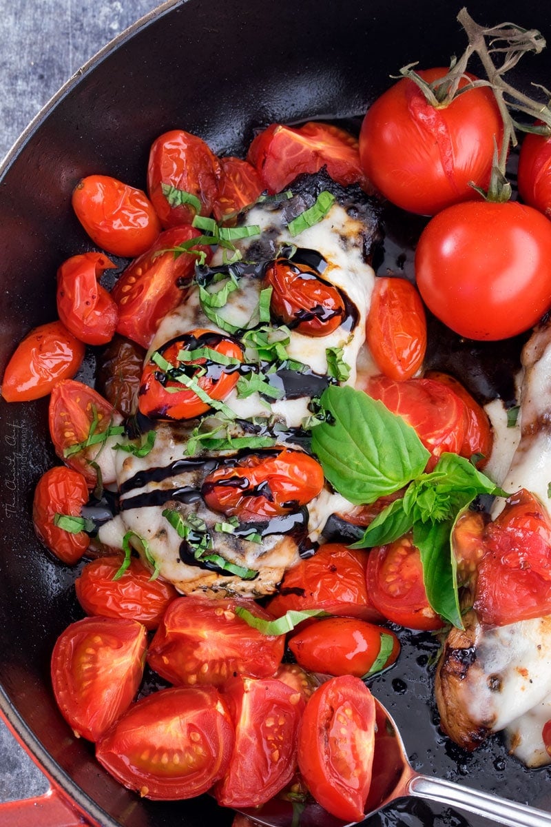 Garlic Balsamic Caprese Chicken | Juicy caprese chicken, marinated in a garlic balsamic marinade, is baked to perfection with burst cherry tomatoes, melted mozzarella cheese, fresh basil! | http://thechunkychef.com