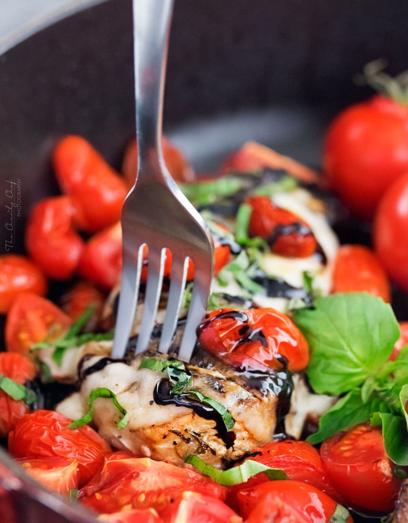 Garlic Balsamic Caprese Chicken | Juicy caprese chicken, marinated in a garlic balsamic marinade, is baked to perfection with burst cherry tomatoes, melted mozzarella cheese, fresh basil! | http://thechunkychef.com