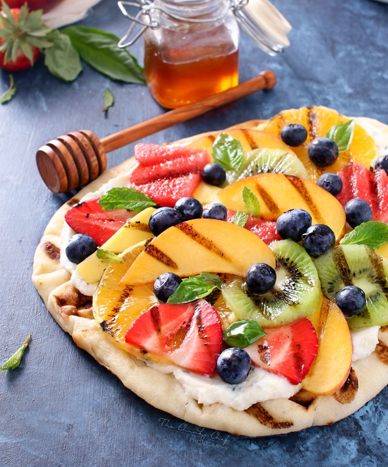 Grilled Fruit Pizza | Flatbread spread with a glorious honey herb whipped ricotta, topped with delicious grilled fruit, drizzled with honey and sprinkled with fresh herbs! | http://thechunkychef.com